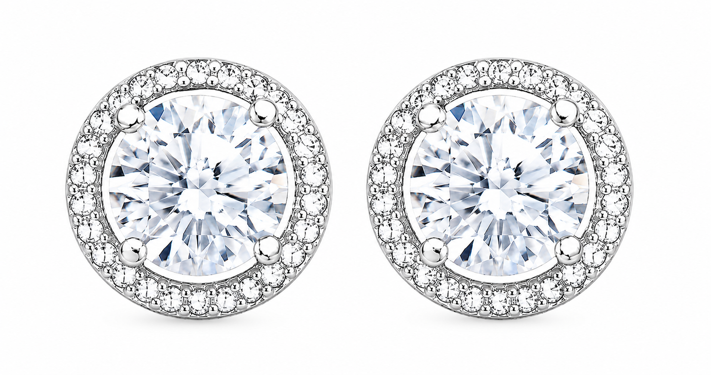 Pair of round diamond earrings on a white background